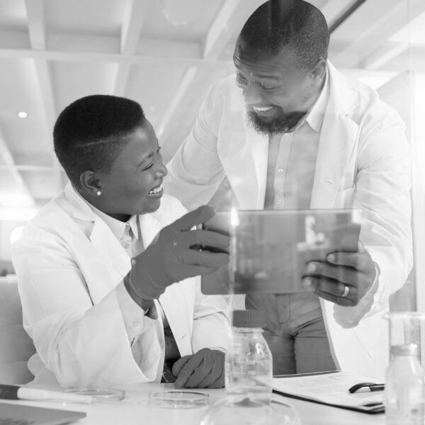 Shot of two scientists using a digital tablet in a laboratory.