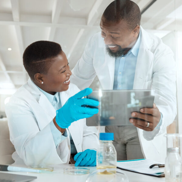 Shot of two scientists using a digital tablet in a laboratory.