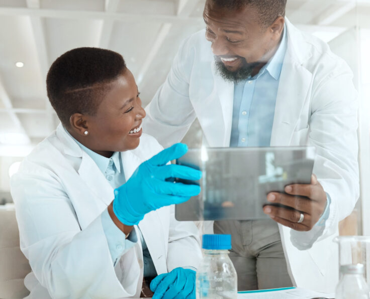 Shot of two scientists using a digital tablet in a laboratory.